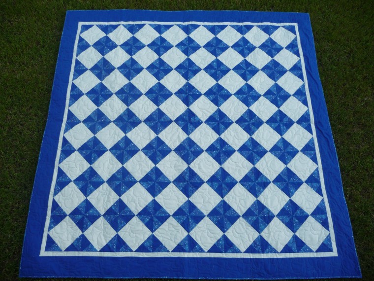 A team of volunteers from Mercy Gilbert & Nimble Thimbles Ensemble a Quilt for Child Abuse Awareness & Prevention Day