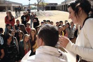 Students collect canned food to give their teacher a Mohawk 