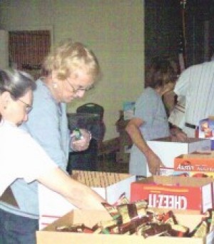 ARC members preparing care boxes