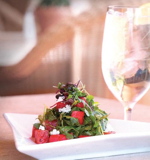 Grilled watermelon with baby arugula and goat cheese salad
