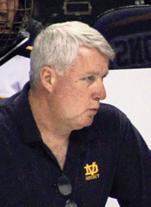 DV hockey coaching team hanging up skates 