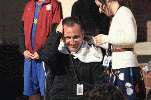 Students collect canned food to give their teacher a Mohawk 