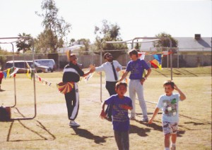 Assistant Principal Joe Torres crosses finish line
