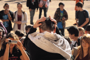 Students collect canned food to give their teacher a Mohawk 