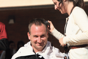 Students collect canned food to give their teacher a Mohawk 