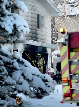 Evening fire damages garage of home in the Heights