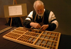 Master printer Mike Parker arranges the letters in his California Job Case before giving elementary school students a printing demonstration at the Buffalo Bill Historical Center on Wednesday. Master printer Mike Parker arranges the letters in his California Job Case before giving elementary school students a printing demonstration at the Buffalo Bill Historical Center on Wednesday.
