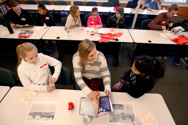 Mackenzie Rogge reads with Central Heights fourth-graders