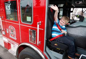 Second-grader with longtime medical issues gets ride home from school in firetruck