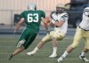 Sean Getchell of Billings central pressures the Dillon quarterback