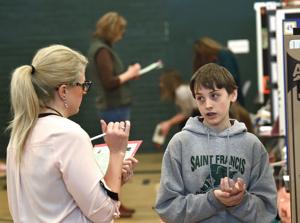 Scientific experiments abound during Saint Francis Science Fair at Billings Central