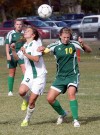 Central's Allie Lucas, 3, and Whitefish's Caroline Carbo, 10, battle for the header