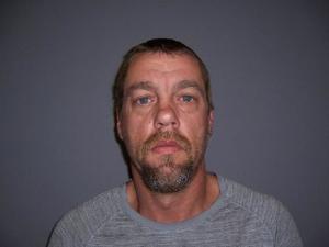 Son grabs knife to defend mother; father appears in court