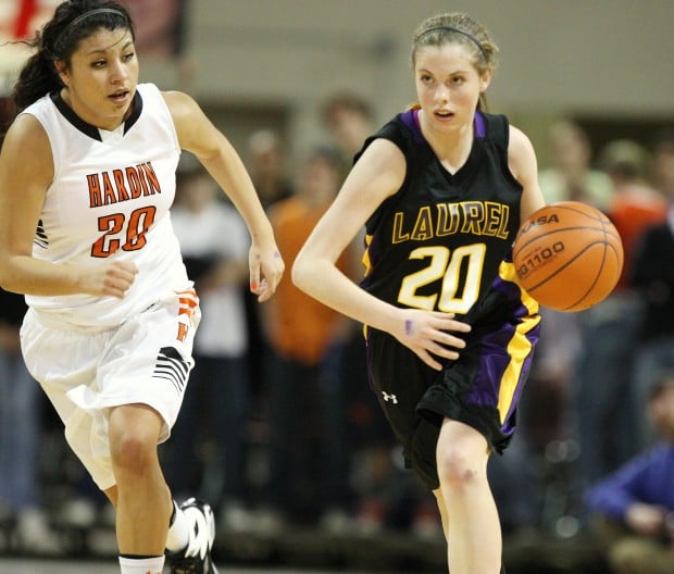 Allie McGrath of Laurel pushes the ball up the floor