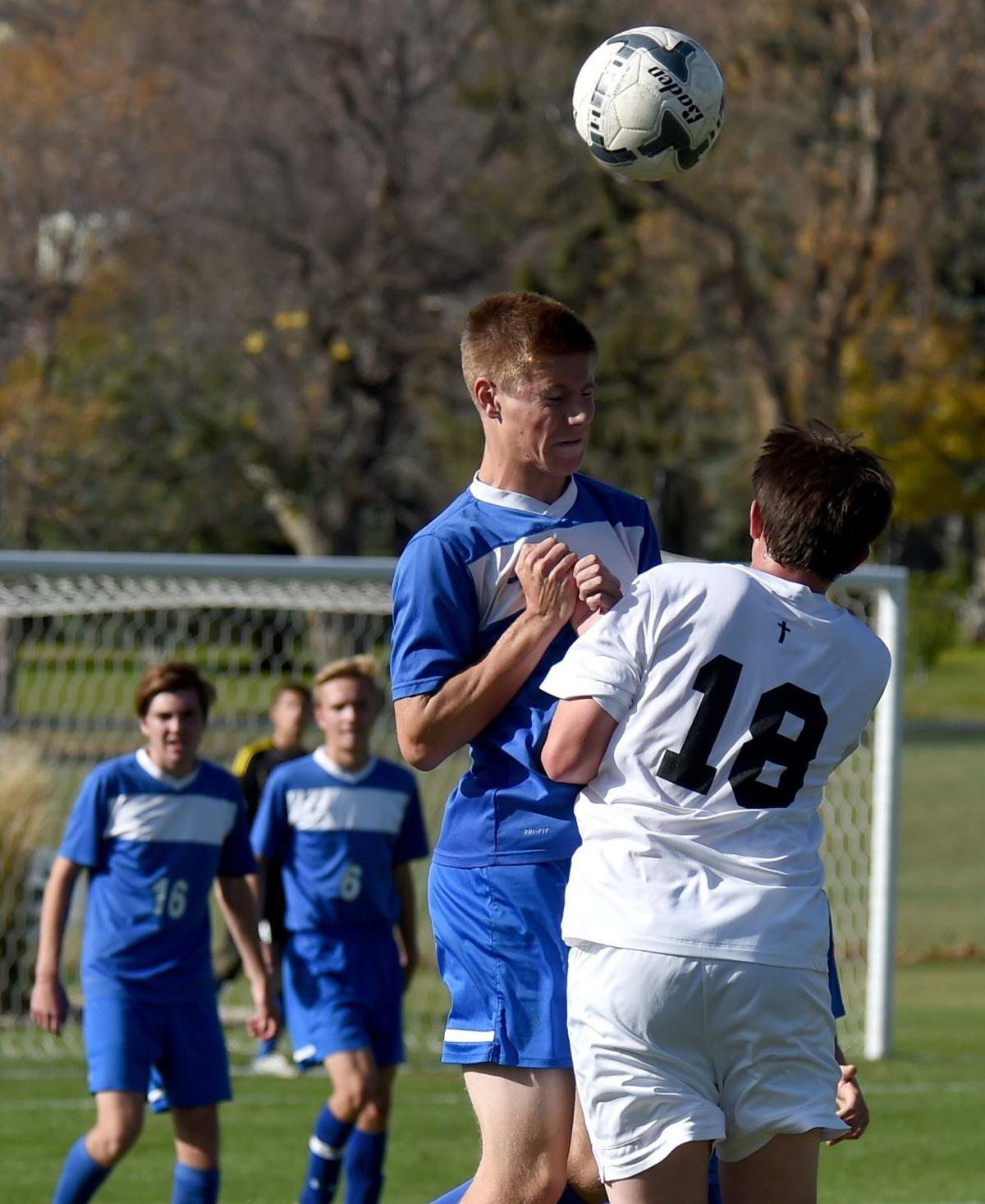 Corvallis' Kolton Mahan heads the ball