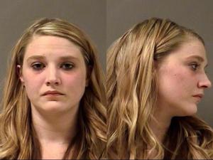 Woman charged with assaulting baby