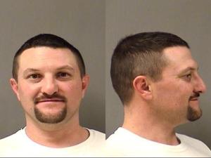 Man charged with strangling woman, threatening to cut off her head