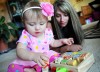 Kalie Milton plays with her 14 month old daughter, Skylie.