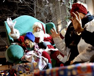 Holiday parade brings joy, candy and tattoos