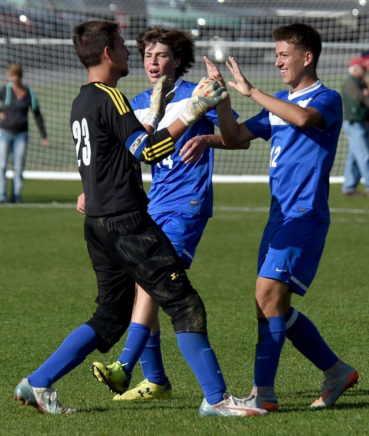 Corvallis' Justin Catanach and Avery Walden celebrate