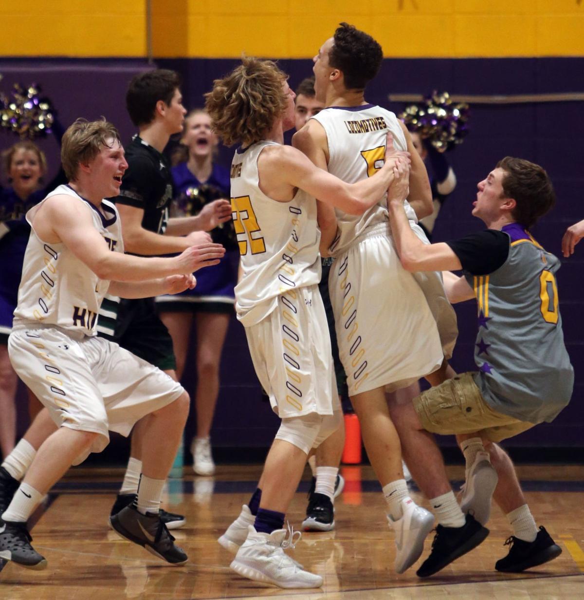 Teammates surround Laurel's Christian Jones