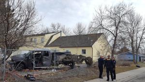Pickup destroyed after crash through yard and into home's fence