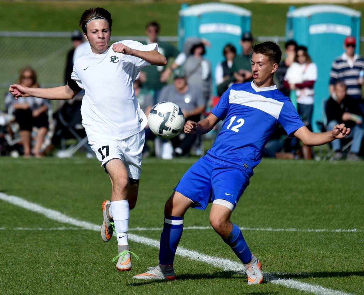 Central's Josh Bundy pursues Corvallis' Avery Walden