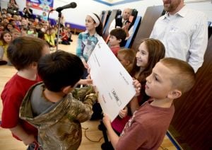 Newman School earns big check to help address a big challenge