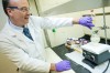 <p>Mike Greener/Chronicle</p>
<p>Microbion chief excutive officer Dr. Brett Baker demonstrates the process to make Bismuth-thiol, a chemical that is used in the creation of antibiotics that fight "mrsa" and "pseudomas" known antibiotics resistant bacteria Thursday afternoon in Bozeman.</p>
