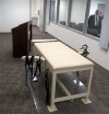 <p>FILE - This Oct. 20, 2011 file photo shows the execution chamber at the Idaho Maximum Security Institution as Warden Randy Blades, right, stands in the observation room, in Boise, Idaho. The Associated Press and 16 other organizations are suing the state of Idaho to force officials to allow media witnesses to view executions in their entirety. The lawsuit, filed in Boise's U.S. District Court on Tuesday, May 22, 2012, asks a federal judge to require the state to increase witness access before the scheduled execution of convicted killer Richard A. Leavitt on June 12. (AP Photo/Jessie L. Bonner, File)</p>
