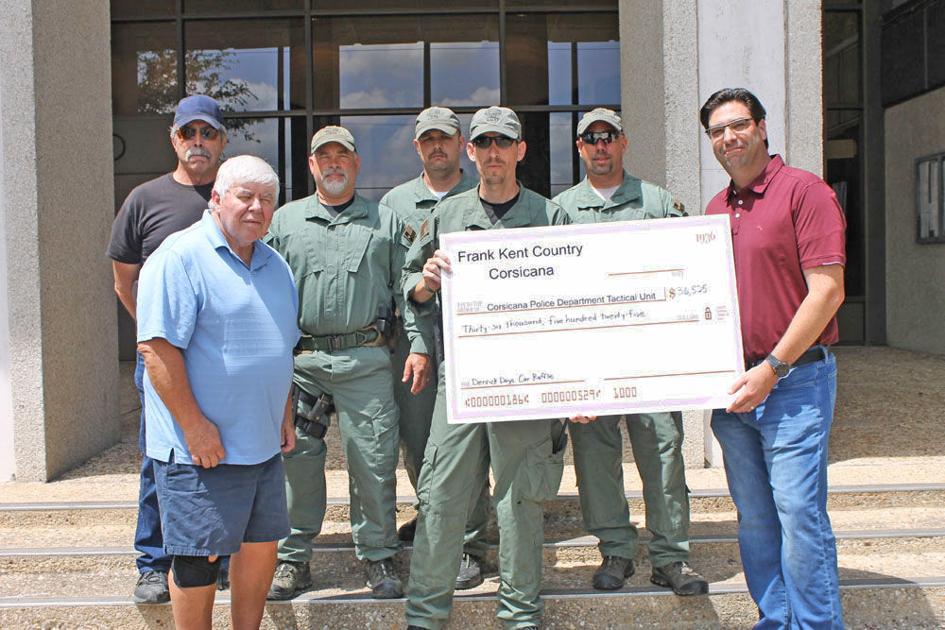 Frank Kent Country presents Derrick Days car raffle proceeds to Corsicana SWAT