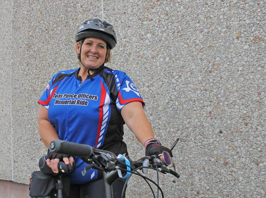 Denson takes bicycle ride in honor of fallen officers