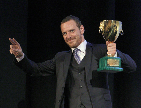 Actor Michael Fassbender holds