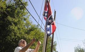 Man quietly protests Confederate flag decision