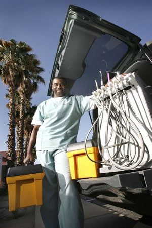 Traveling dentist gets to route of problems 