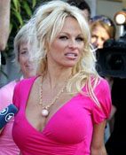 Paparazzi boo Pamela Anderson at Cannes 
