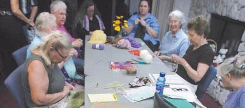 Shawls knitted in love spread from Mesa to wide world 
