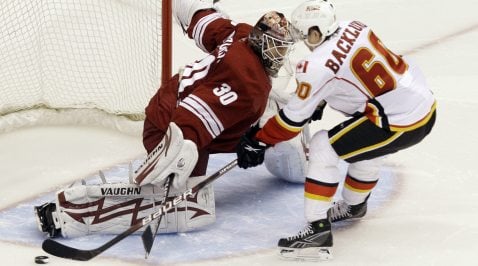 Coyotes blow lead but top Flames in shootout 