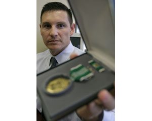 Army officer downplays Afghan heroism 