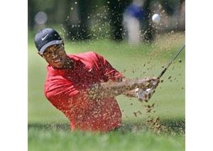 Tiger Woods easily captures 12th major title 