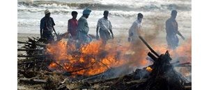 Asia rushes to bury bodies; death toll at 67,000 