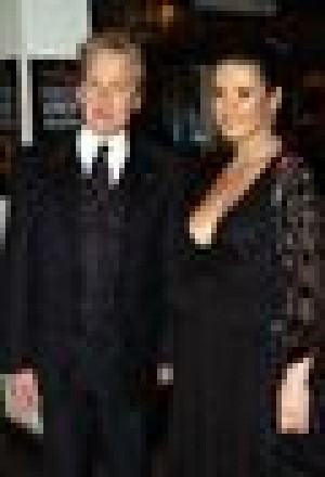 Zeta-Jones, Douglas win magazine suit 