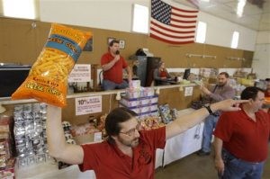 Bargain-hunters buying groceries at auction 