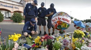 Spirit of fallen cop looms over killing scene 