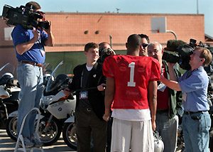 Media swarm BCS coaches, players 