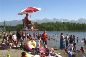 <p>In this photo taken Monday, June 17, 2013, people swim and sunbathe at Goose Lake in Anchorage, Alaska. Alaska's largest city and other parts of the state are experiencing a long stretch of higher than normal temperatures. (AP Photo/Rachel D'Oro)</p>
