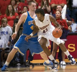 Bruins avoid upset to Cats 