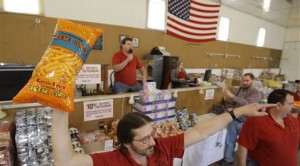 Bargain-hunters buying groceries at auction 