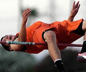 Senior high jumper trying for 7-2 mark at Rotary meet 