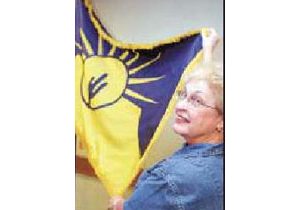 Winning flag in Tribune’s contest adopted 